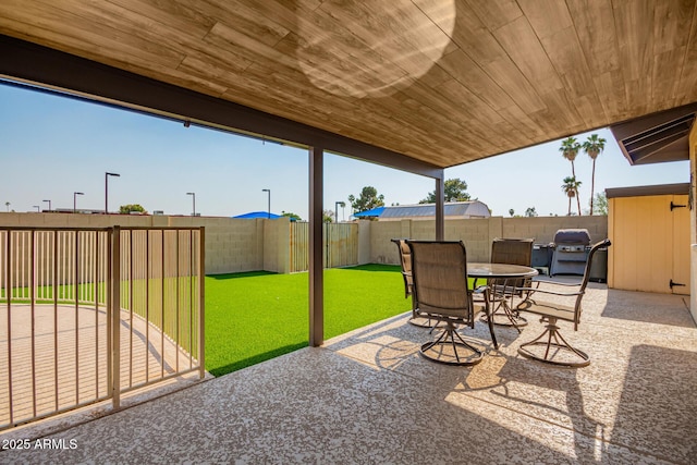 3901 W Augusta Ave, Phoenix, AZ 85051 - view of patio featuring a fenced backyard, grilling area, and outdoor dining space