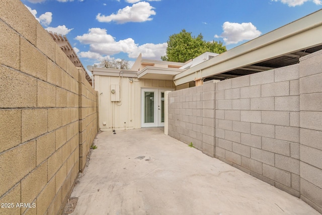 view of patio featuring french doors and a fenced backyard