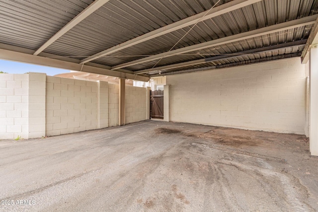 garage featuring concrete block wall