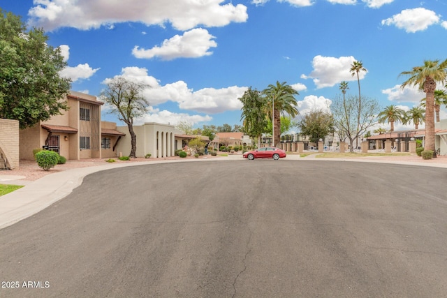 view of road with sidewalks and a residential view