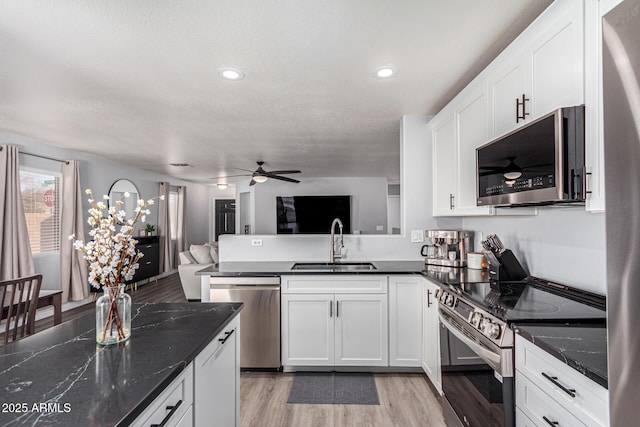 kitchen featuring white cabinetry, sink, and stainless steel appliances