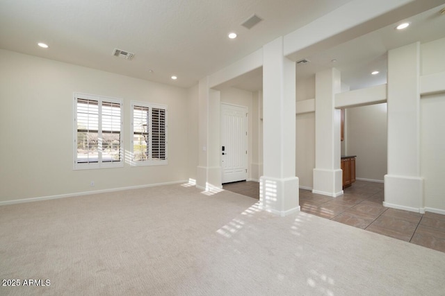 carpeted spare room with recessed lighting, visible vents, and baseboards