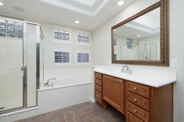 bathroom featuring vanity, visible vents, recessed lighting, a shower stall, and a garden tub