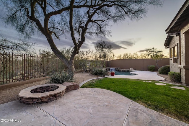 view of patio featuring a fire pit and a fenced backyard