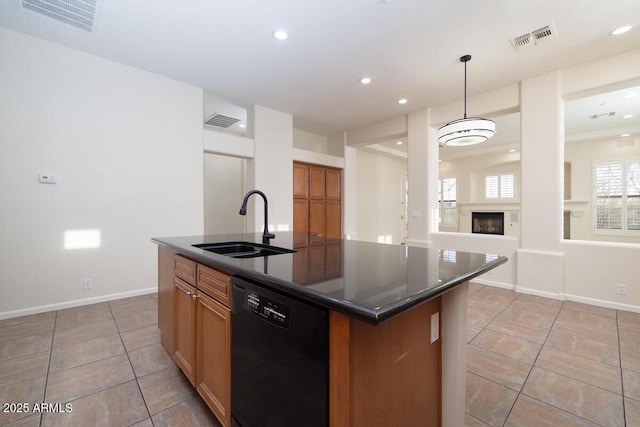 kitchen featuring a sink, visible vents, black dishwasher, and dark countertops