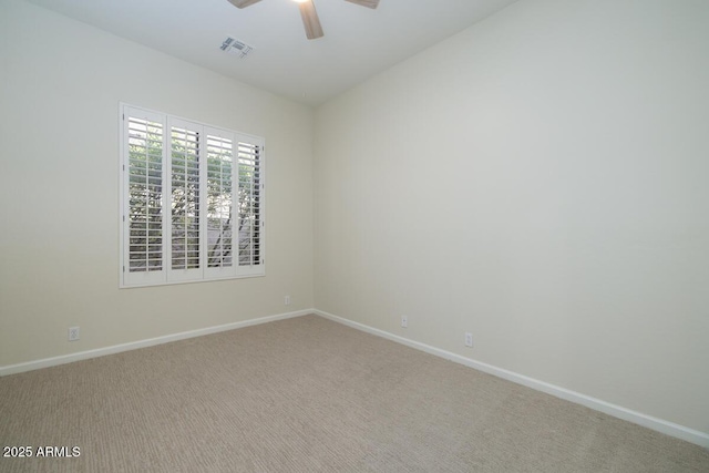 unfurnished room featuring baseboards, visible vents, carpet floors, and ceiling fan