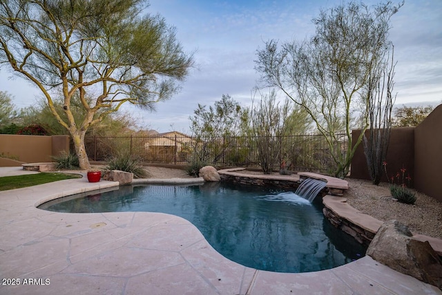 view of swimming pool featuring a fenced in pool, a fenced backyard, and a patio area