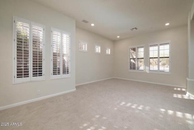 spare room featuring visible vents, recessed lighting, baseboards, and carpet floors