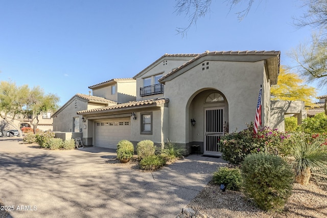 mediterranean / spanish-style home featuring a garage