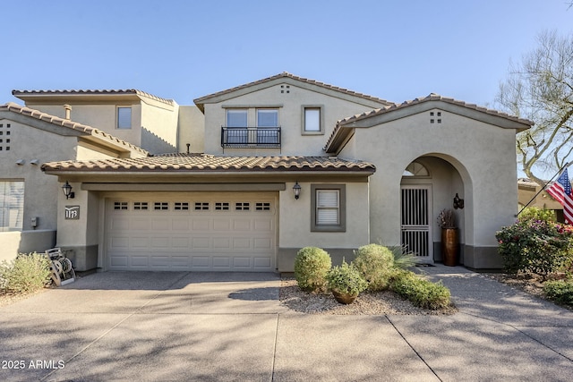 mediterranean / spanish home featuring a garage