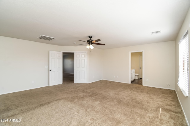 empty room featuring carpet and ceiling fan