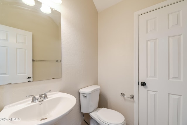 bathroom with sink and toilet