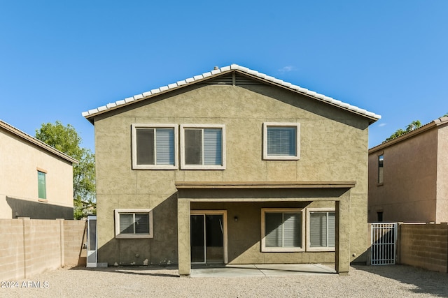 back of property with a patio area