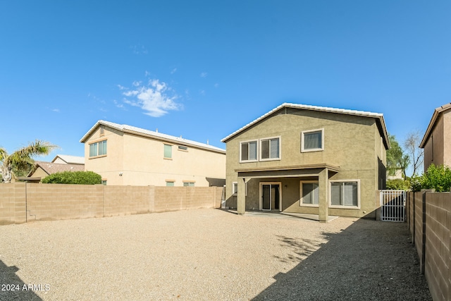 back of property with a patio area