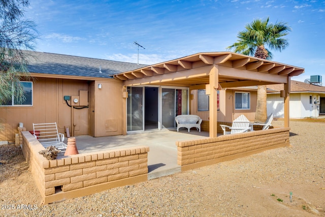 back of property featuring a patio and central AC unit