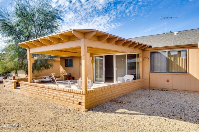 back of property featuring a patio