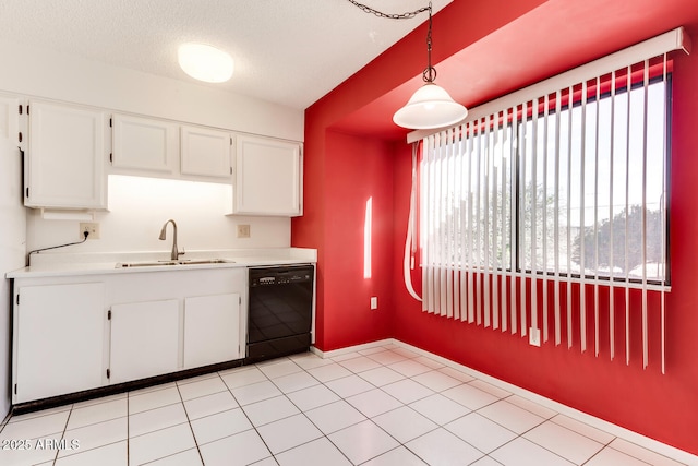 kitchen featuring sink, dishwasher, a textured ceiling, white cabinets, and decorative light fixtures