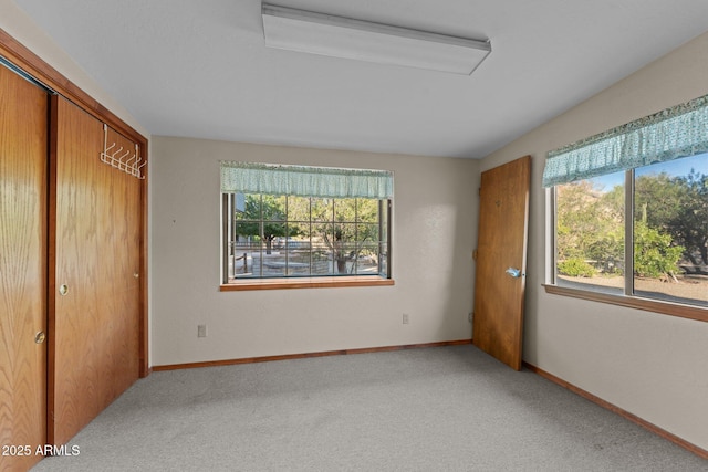 27610 W Gill Rd, Morristown, AZ 85342 - unfurnished bedroom featuring carpet, a closet, baseboards, and attic access