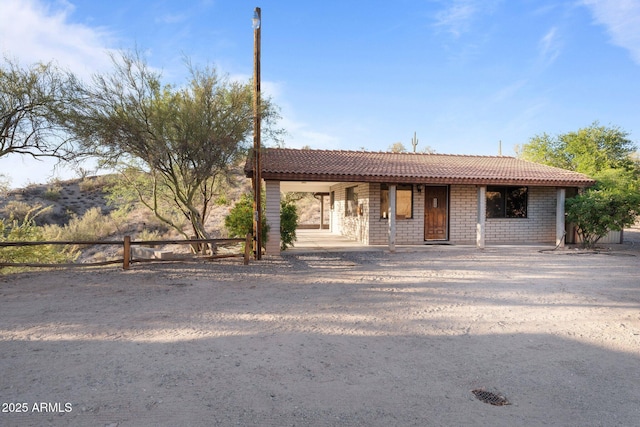 27610 W Gill Rd, Morristown, AZ 85342 - ranch-style home with a tiled roof and a porch