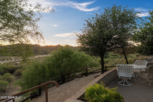 27610 W Gill Rd, Morristown, AZ 85342 - patio terrace at dusk featuring outdoor dining space