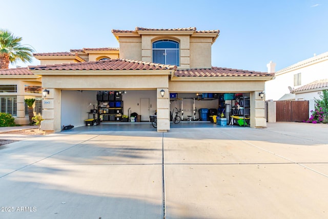 mediterranean / spanish house with a garage