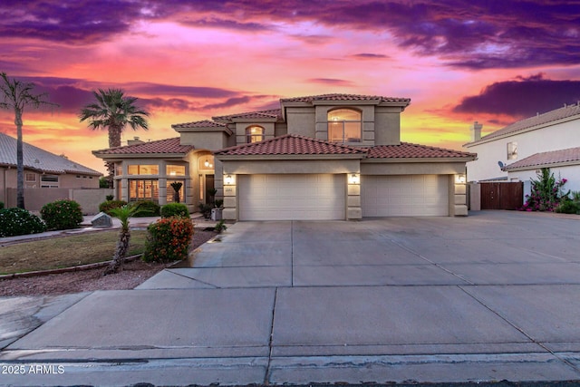 mediterranean / spanish-style house featuring a garage