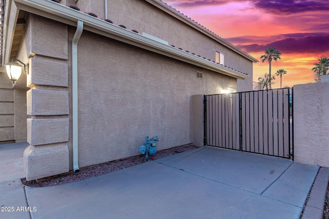 view of property exterior at dusk