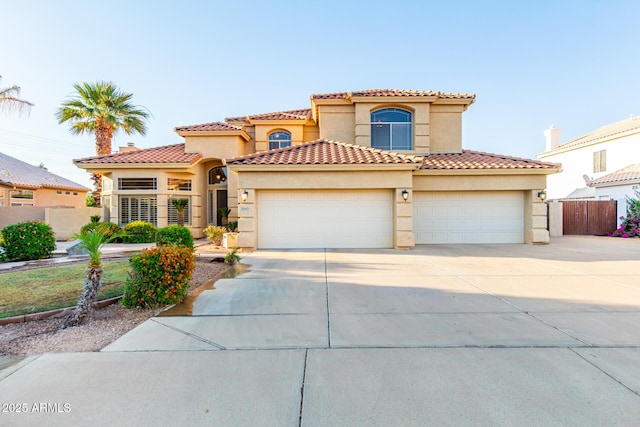 mediterranean / spanish-style home featuring a garage