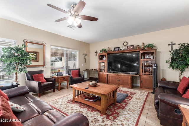 tiled living room featuring ceiling fan