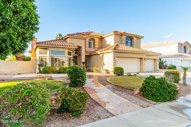 mediterranean / spanish-style home with a garage