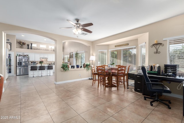 dining area featuring light tile patterned floors and ceiling fan