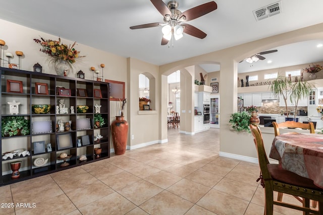 tiled dining room with ceiling fan