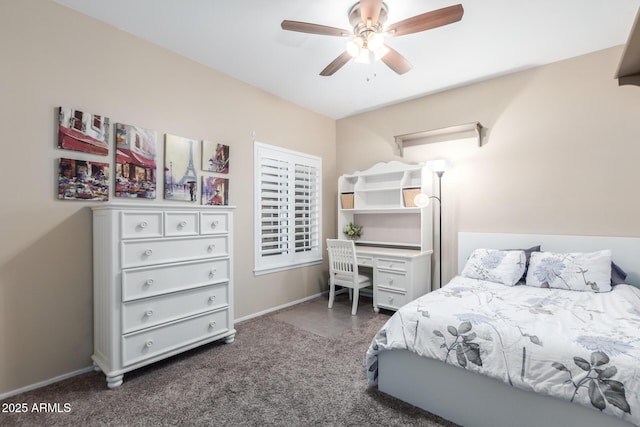 bedroom featuring ceiling fan and dark carpet