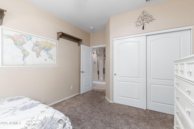 bedroom with a closet and carpet flooring