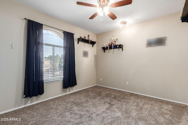 unfurnished room with ceiling fan and carpet floors