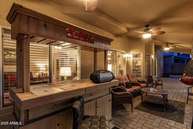 view of patio / terrace featuring ceiling fan