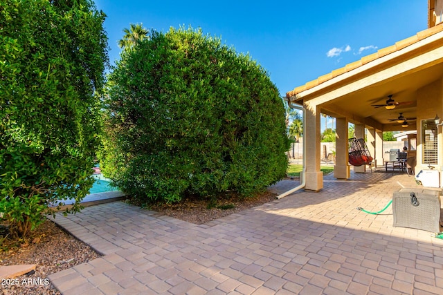 view of patio with ceiling fan