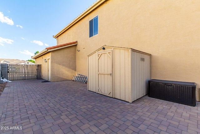 exterior space with a shed