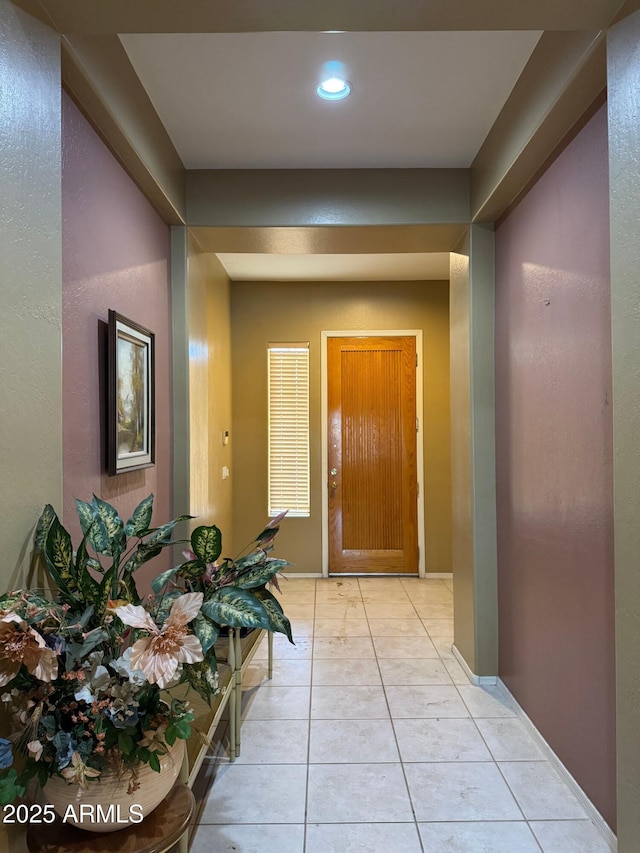 hallway with light tile patterned floors