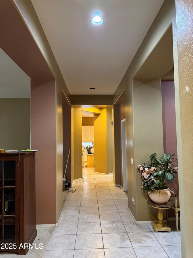 hallway with light tile patterned floors