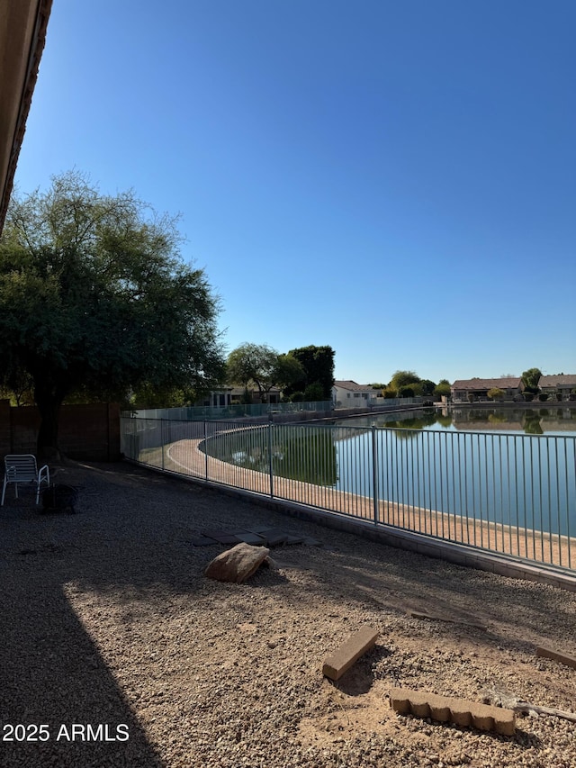 view of pool featuring a water view