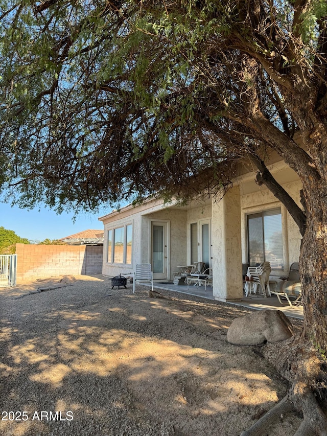 back of house featuring a patio area