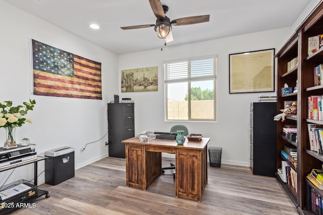 office area featuring recessed lighting, a ceiling fan, baseboards, and light wood finished floors