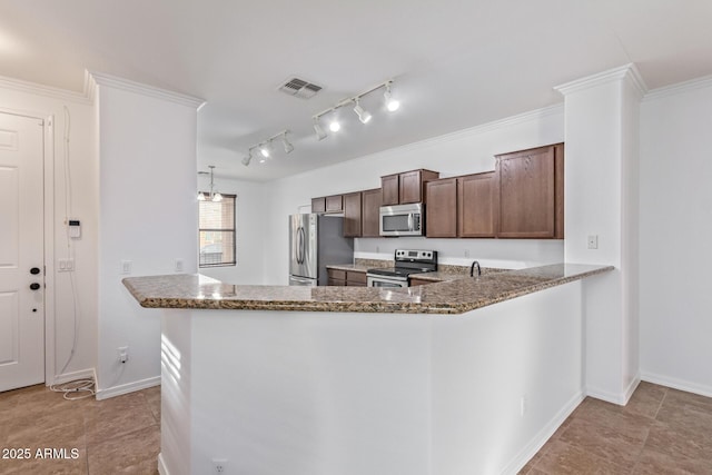 kitchen with stone countertops, dark brown cabinets, appliances with stainless steel finishes, ornamental molding, and kitchen peninsula