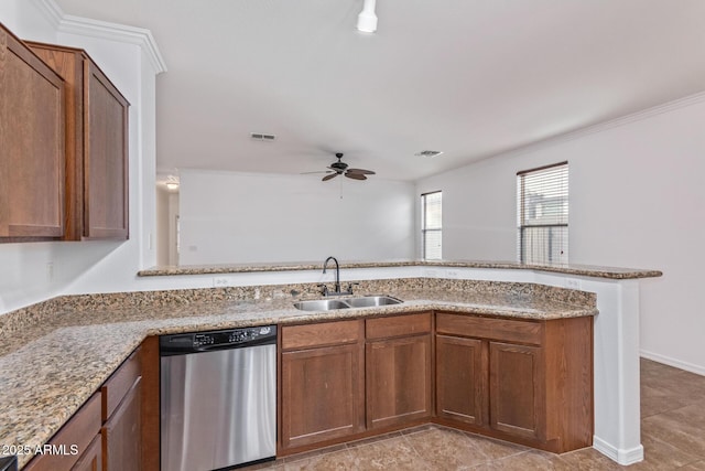 kitchen with sink, ornamental molding, light stone countertops, stainless steel dishwasher, and kitchen peninsula