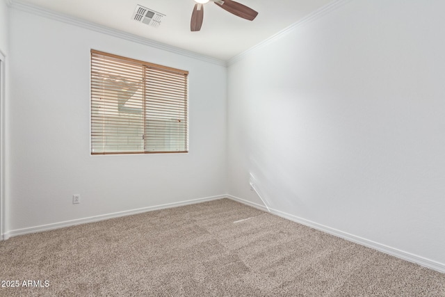 carpeted empty room with crown molding and ceiling fan