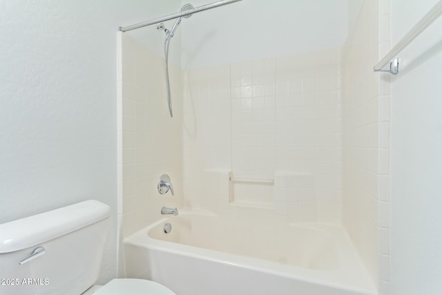 bathroom with shower / washtub combination and toilet