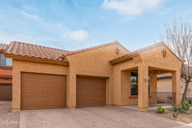 view of front of home featuring a garage and a porch