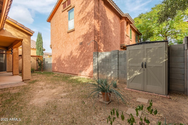 exterior space featuring a storage shed