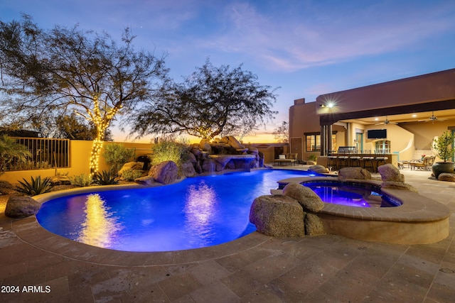 view of swimming pool featuring an in ground hot tub, a patio, and ceiling fan